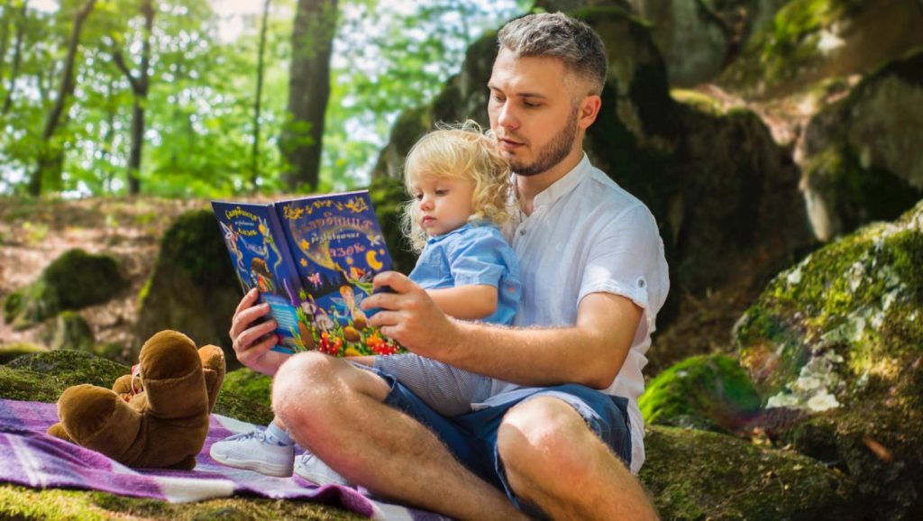 Father and Daughter read a book together